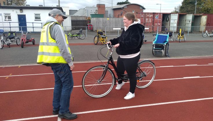 Tony teaching Steph to ride on two wheels